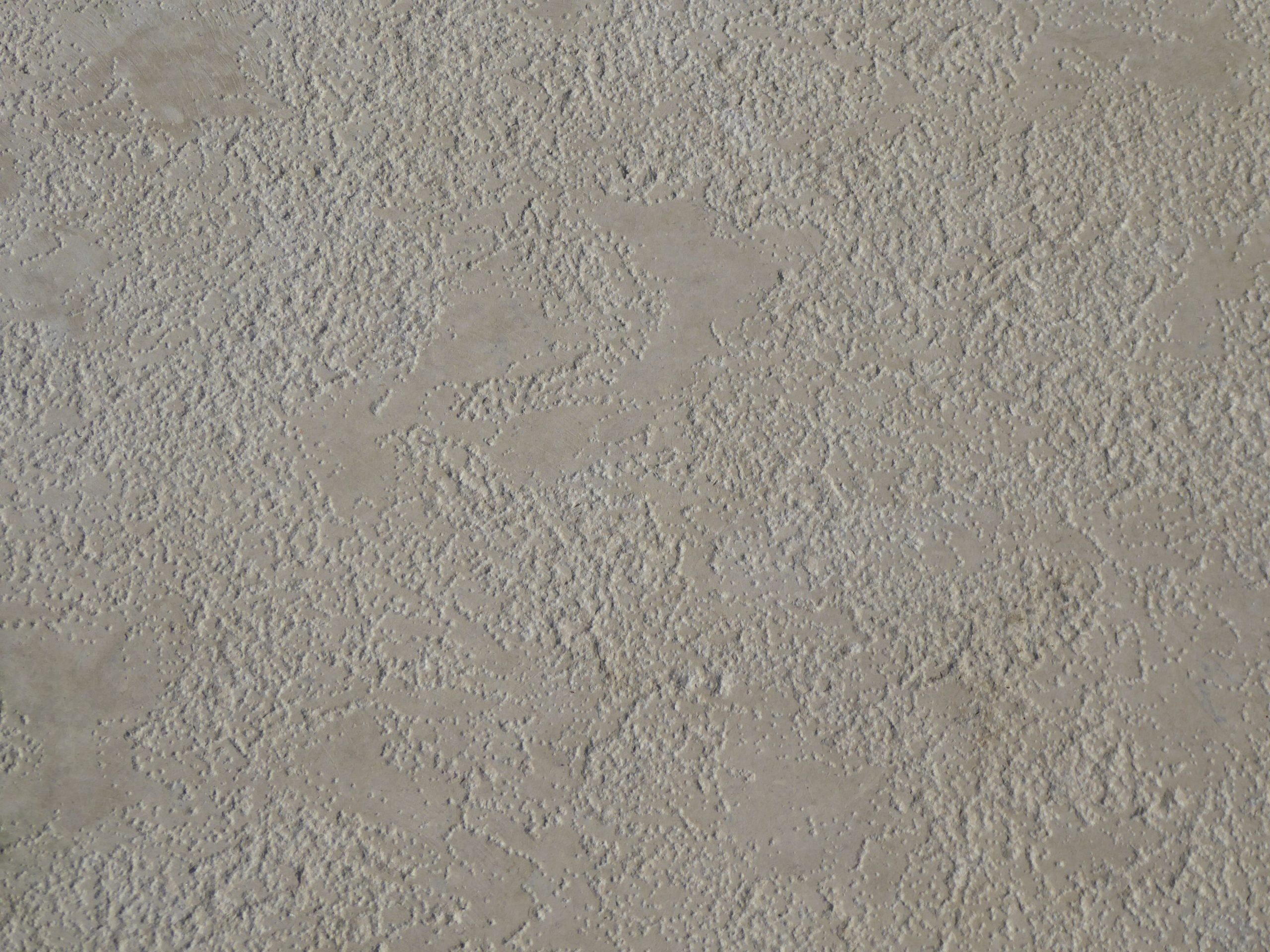 Surface béton beige texturée détails