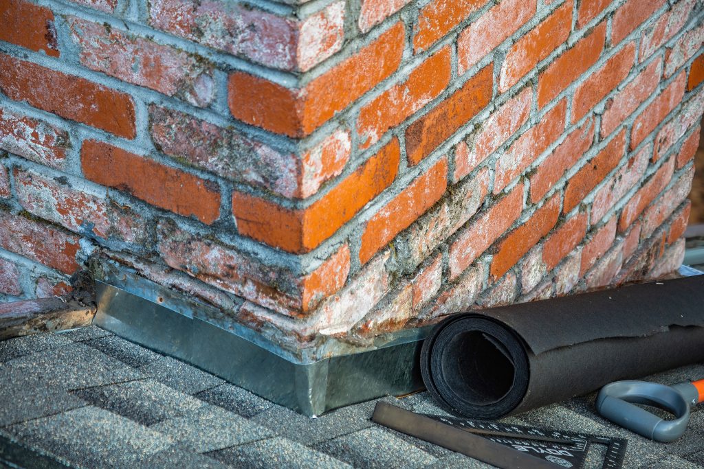 Détail cheminée brique outils matériaux réparation
