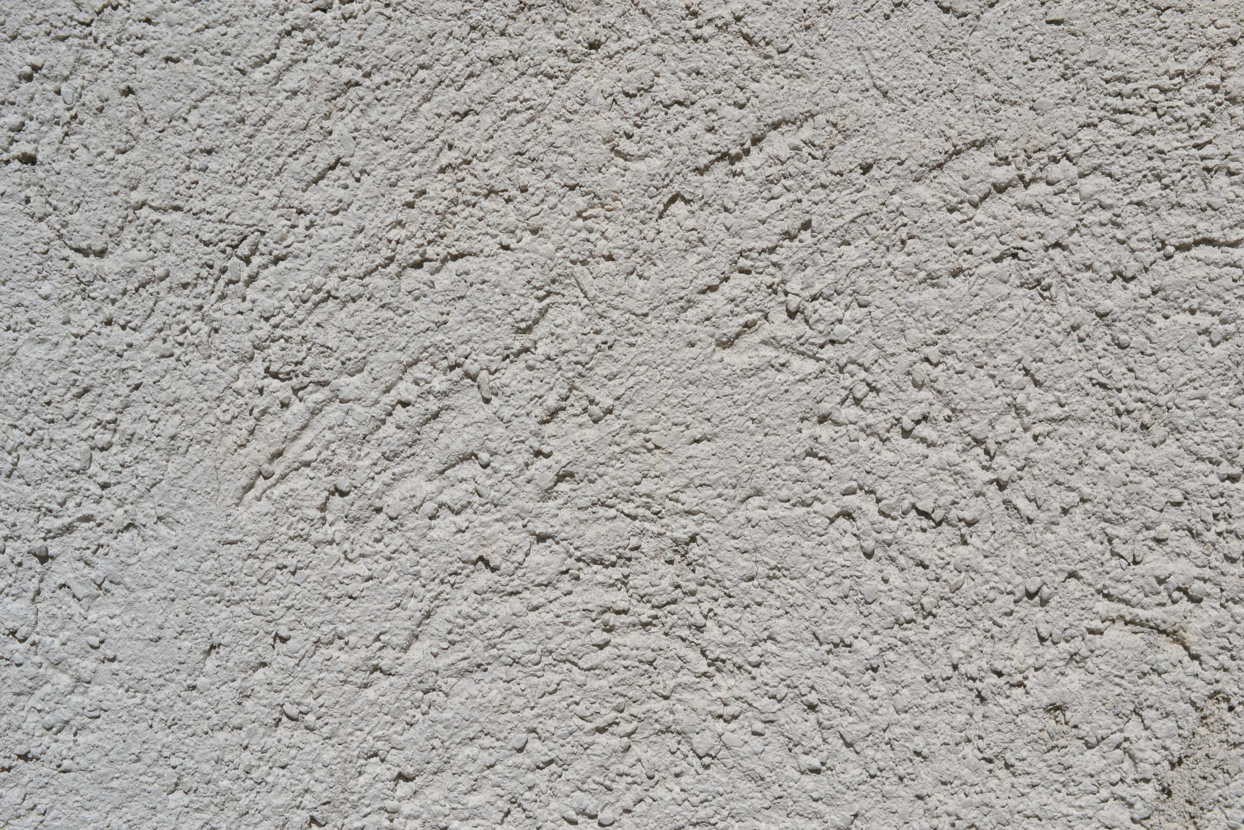 Surface stucco gris clair texturée